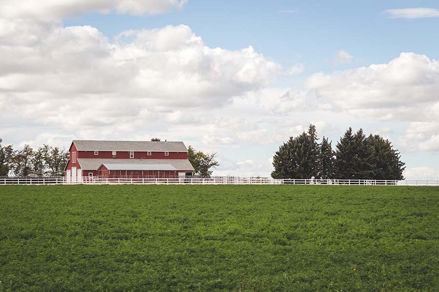 Meridian ID - View of Rural Farmhouse on Open Field in Meridian Idaho